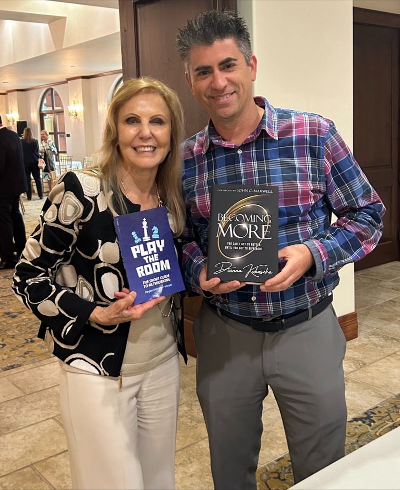 Exchanging books with national speaker & author Dianna Kokoszka who helped build the most profitable
